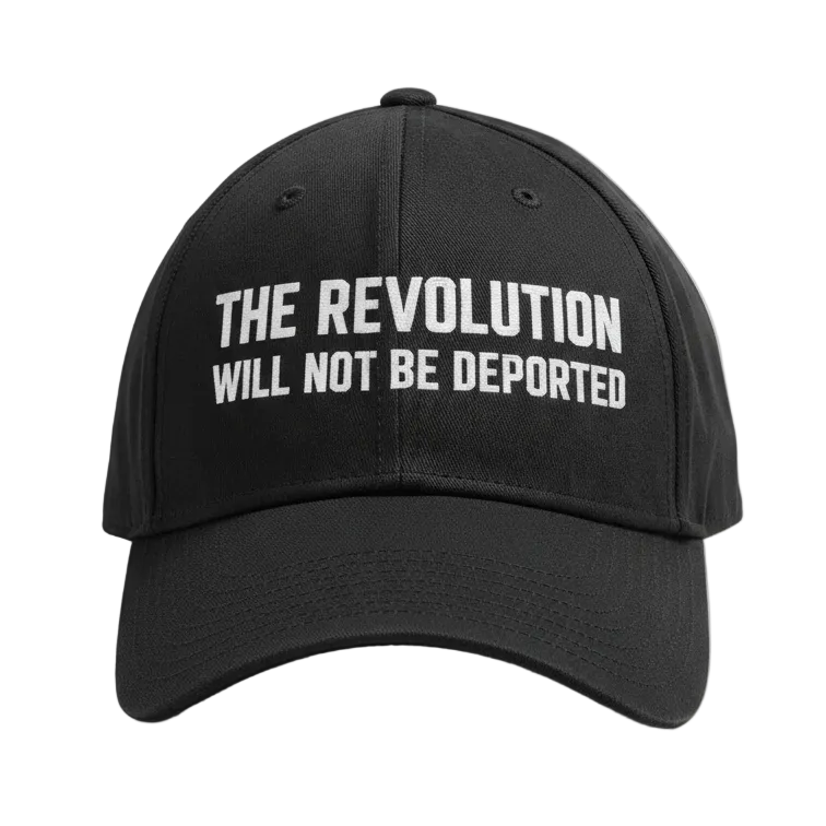 Black cap with 'The Revolution Will Not Be Deported' text on a white background